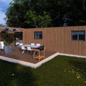 Module en bois Le Haven avec terrasse aménagée, bardage bois vertical et pergola intégrée, installé dans un environnement verdoyant.