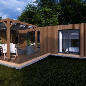 Module en bois moderne "L'Escapade" avec terrasse couverte et pergola, installé dans un cadre verdoyant.
